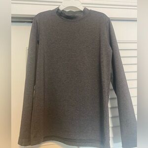 Under Armour kids long sleeve shirt with high neck, great to wear under jerseys